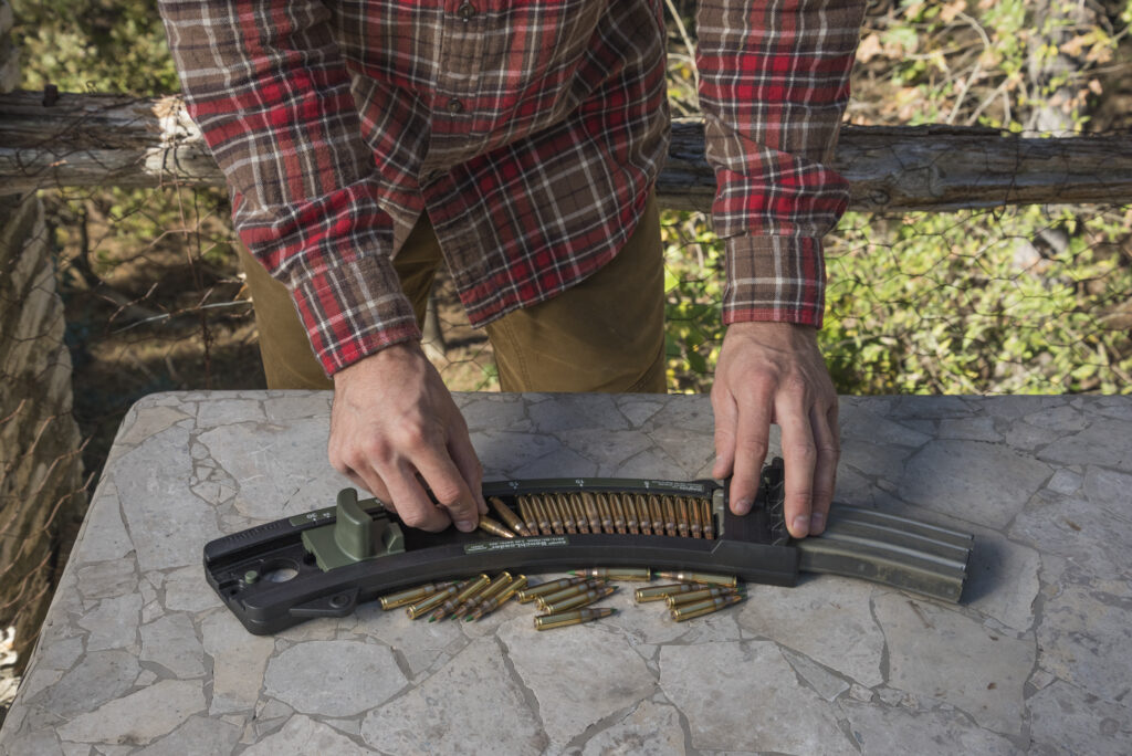 Using a bench loader for reloading magazines