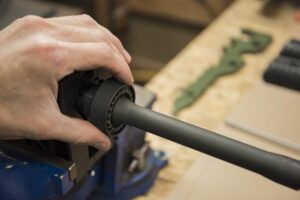 Sliding the delta ring assembly off the barrel
