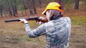 The author shooting a rifle at the range