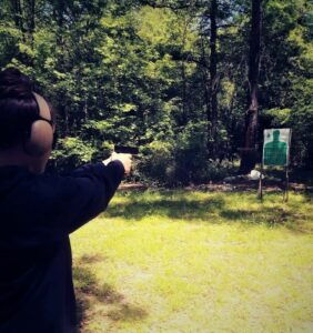 The author shooting the ball and dummy drill at an outdoor shooting range.
