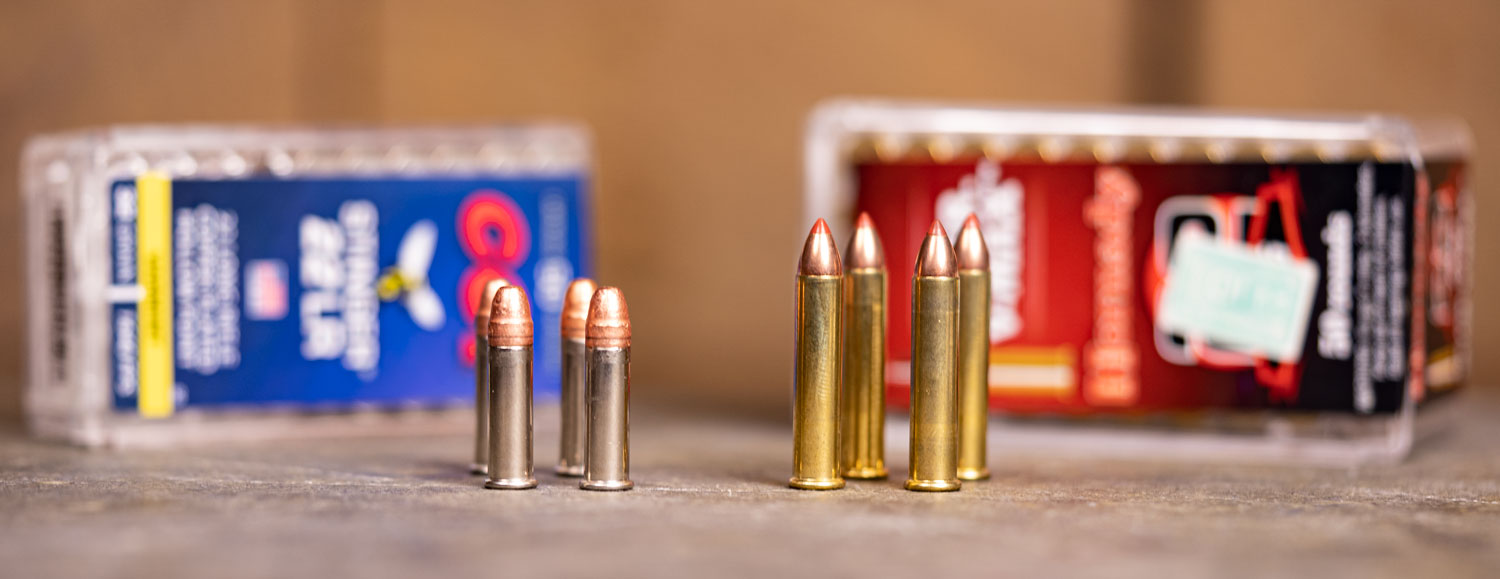 22lr ammo and 22 wmr ammo side by side on a table