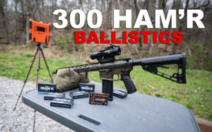 A 300 Ham'r rifle with ammo and a chronograph at the shooting range