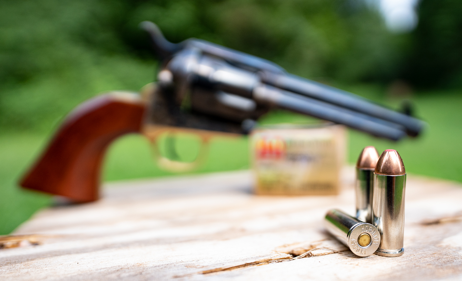 A 45 LC revolver with ammo at a shooting range
