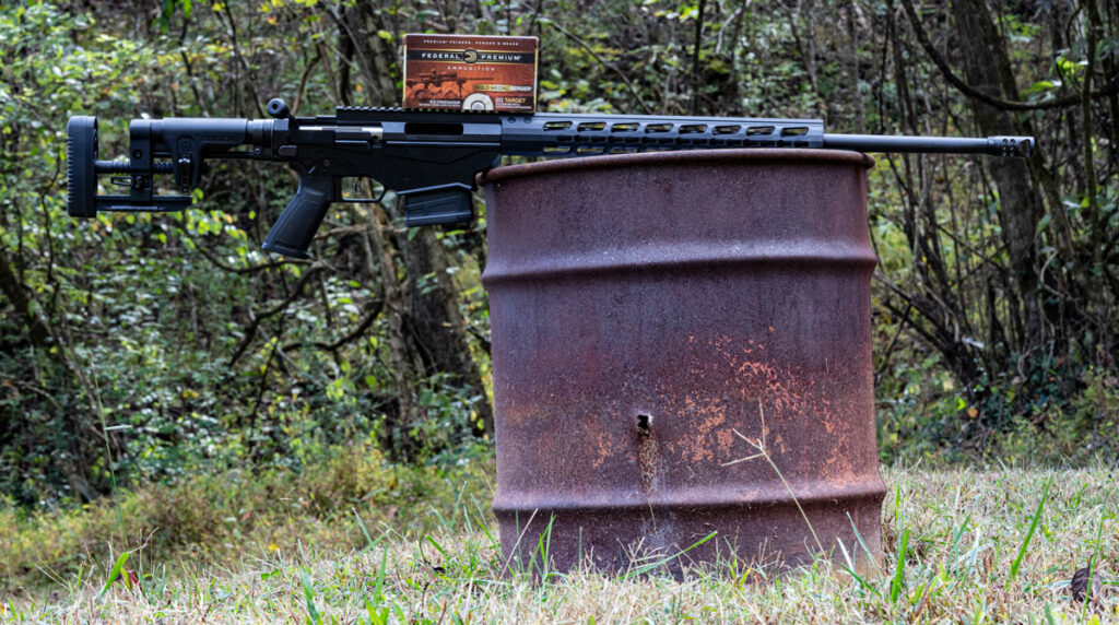 6.5 creedmoor rifle on a barrel with ammo