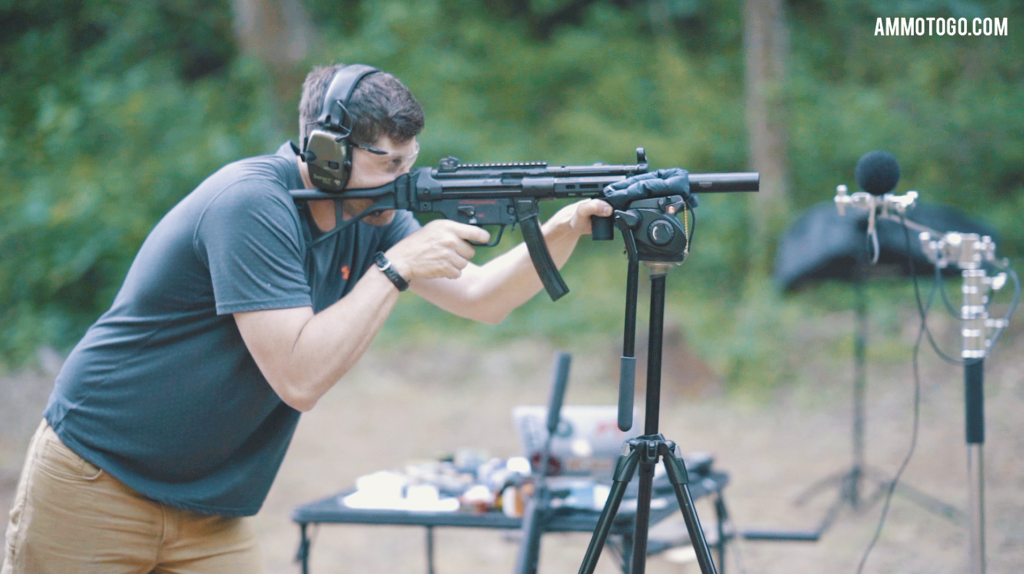 A man testing the audio levels of gun silencers