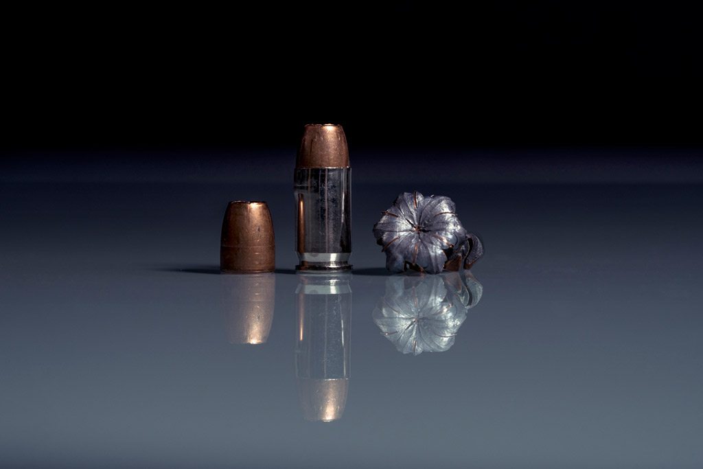 photo of .380 acp ammo with reflection