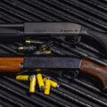 photo of a 12 gauge shot gun and a 20 gauge shotgun