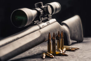 photo of a Remington 700 rifle with 308 ammo and scope