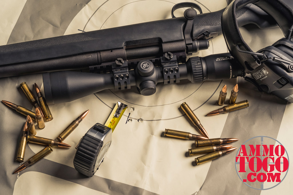 Measuring MOA with a rifle and a target at the range photo of remington 700 rifle with target and ammo