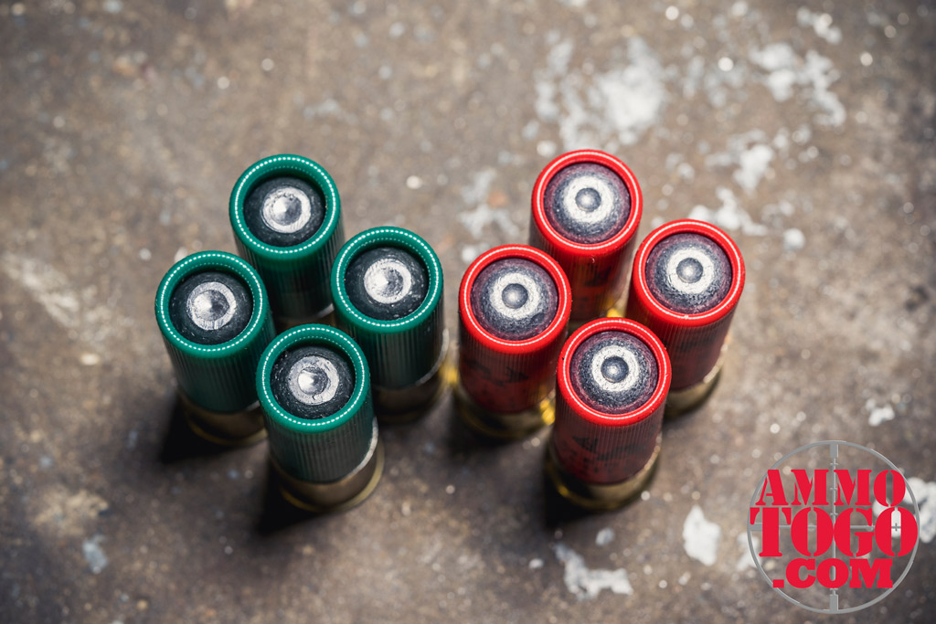 12 gauge rifled shotgun shells stacked in a side-by-side comparison photo of rifled shotgun shells for use as 12 gauge shotgun ammo on a concrete floor