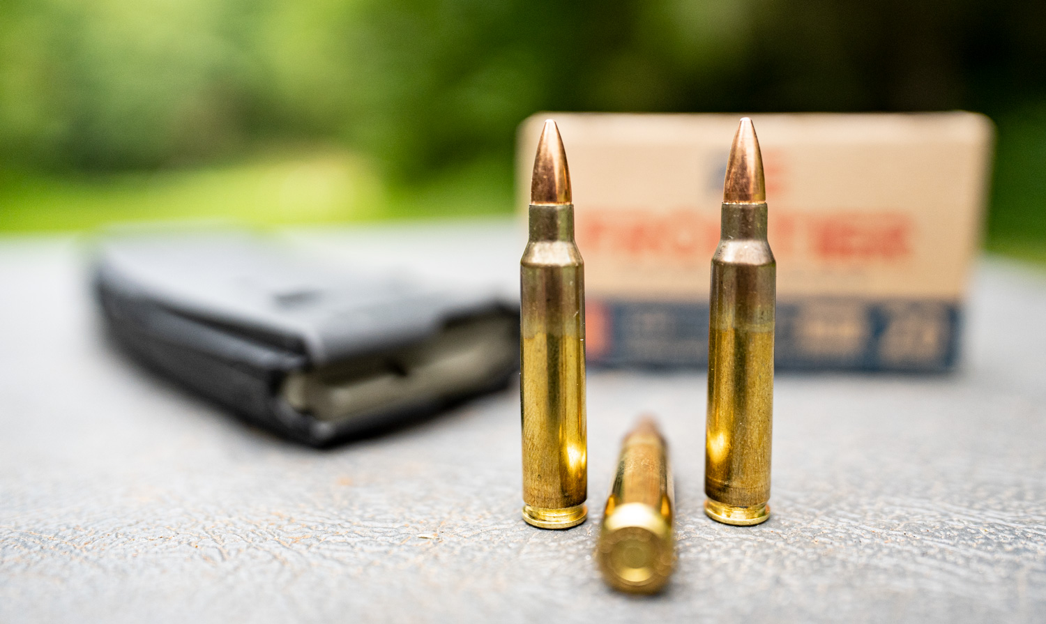 Brass cased ammo on a shooting bench