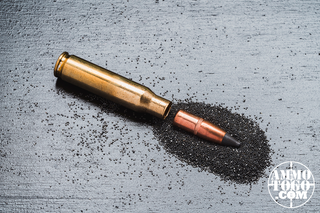 A round of Winchester Deer Season XP ammo dissected with the bullet, casing and powder separated.