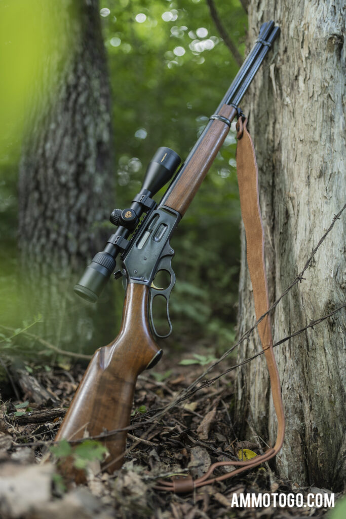 Marlin Model 336 rifle leaning against tree