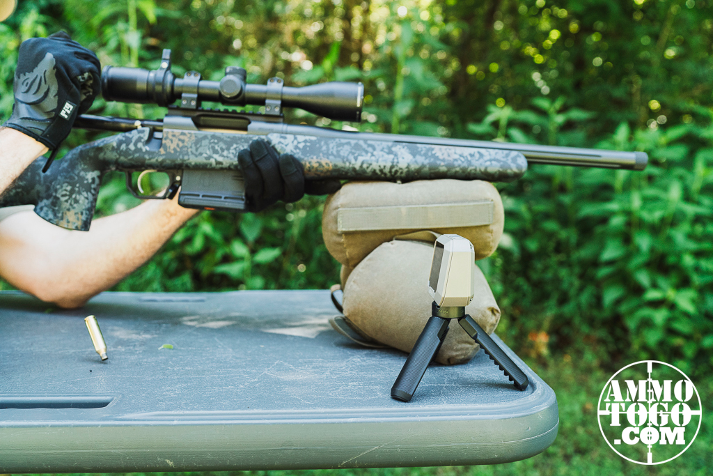 The author firing a 22 Creedmoor rifle off a shooting bench