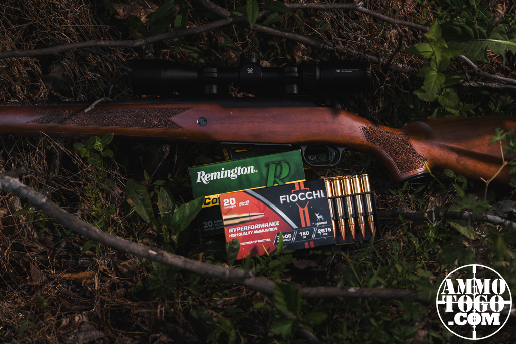 A 30-06 rifle with ammo in the woods