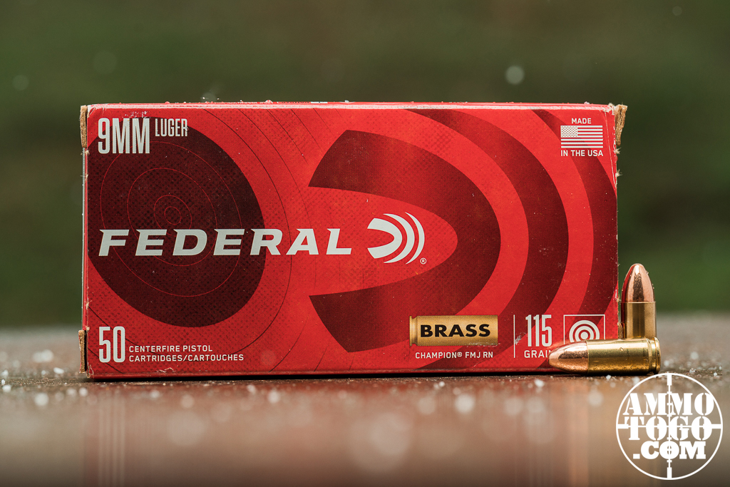 Federal Champion 9mm ammo displayed at an outdoor shooting range