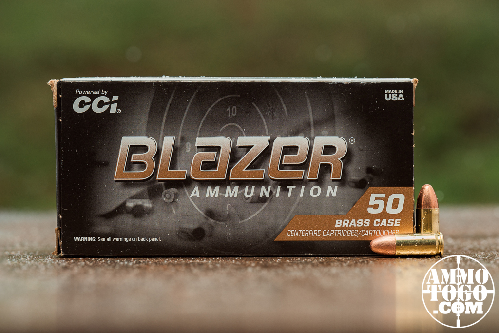 Reduced Recoil Blazer Brass 9mm ammo displayed at a shooting range
