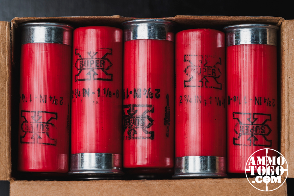 12 gauge ammo shells lined up in an ammo box