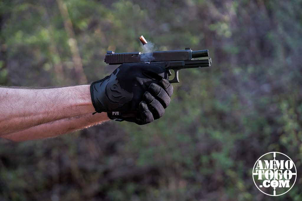 The author shooting low recoil 9mm ammo at an outdoor shooting range