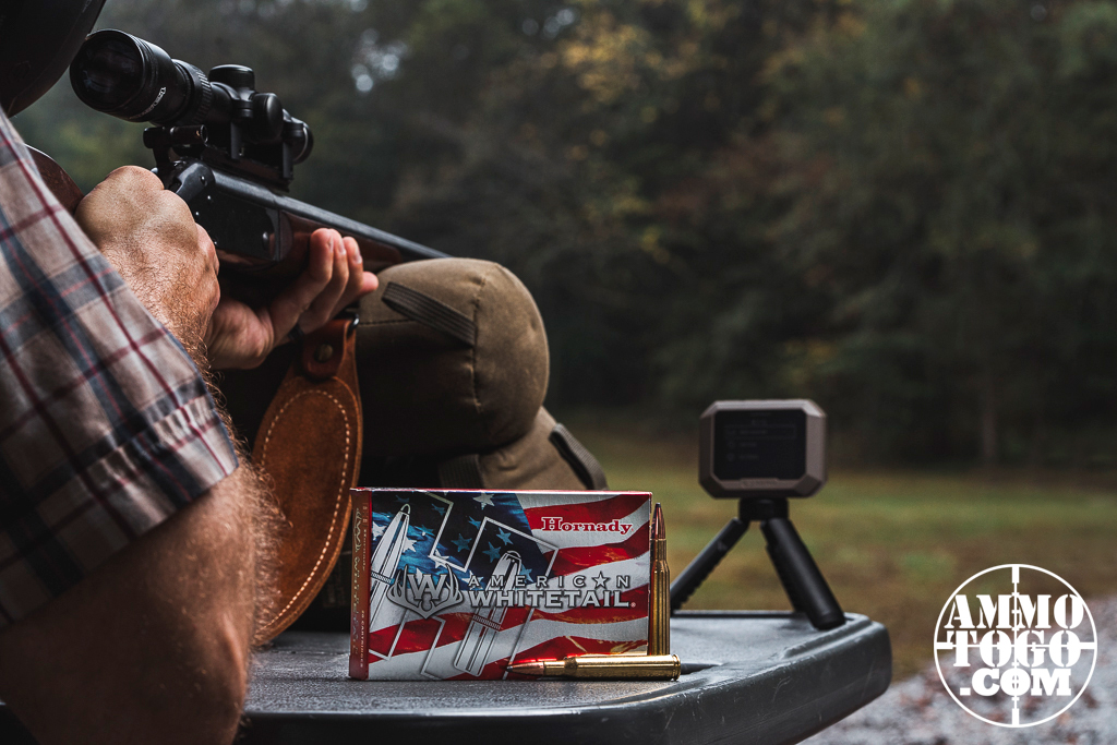 Shooting a 270 rifle from a benchrest at a firing range.