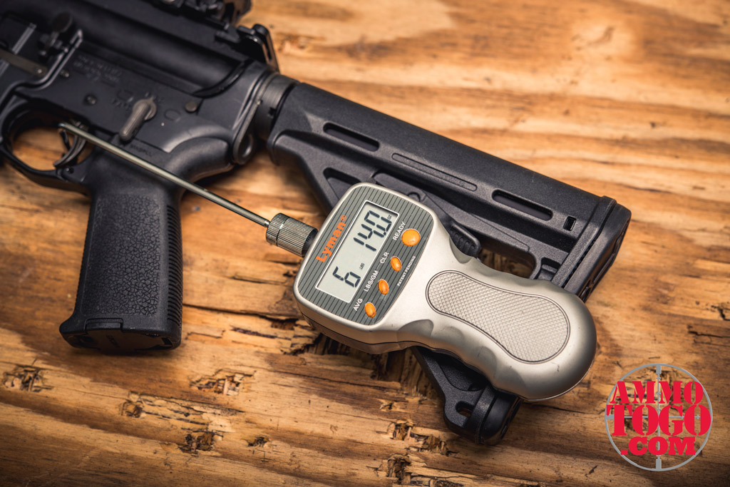 a colt ar15 rifle with a digital trigger weight gauge photo of a colt ar15 rifle with a digital trigger weight gauge