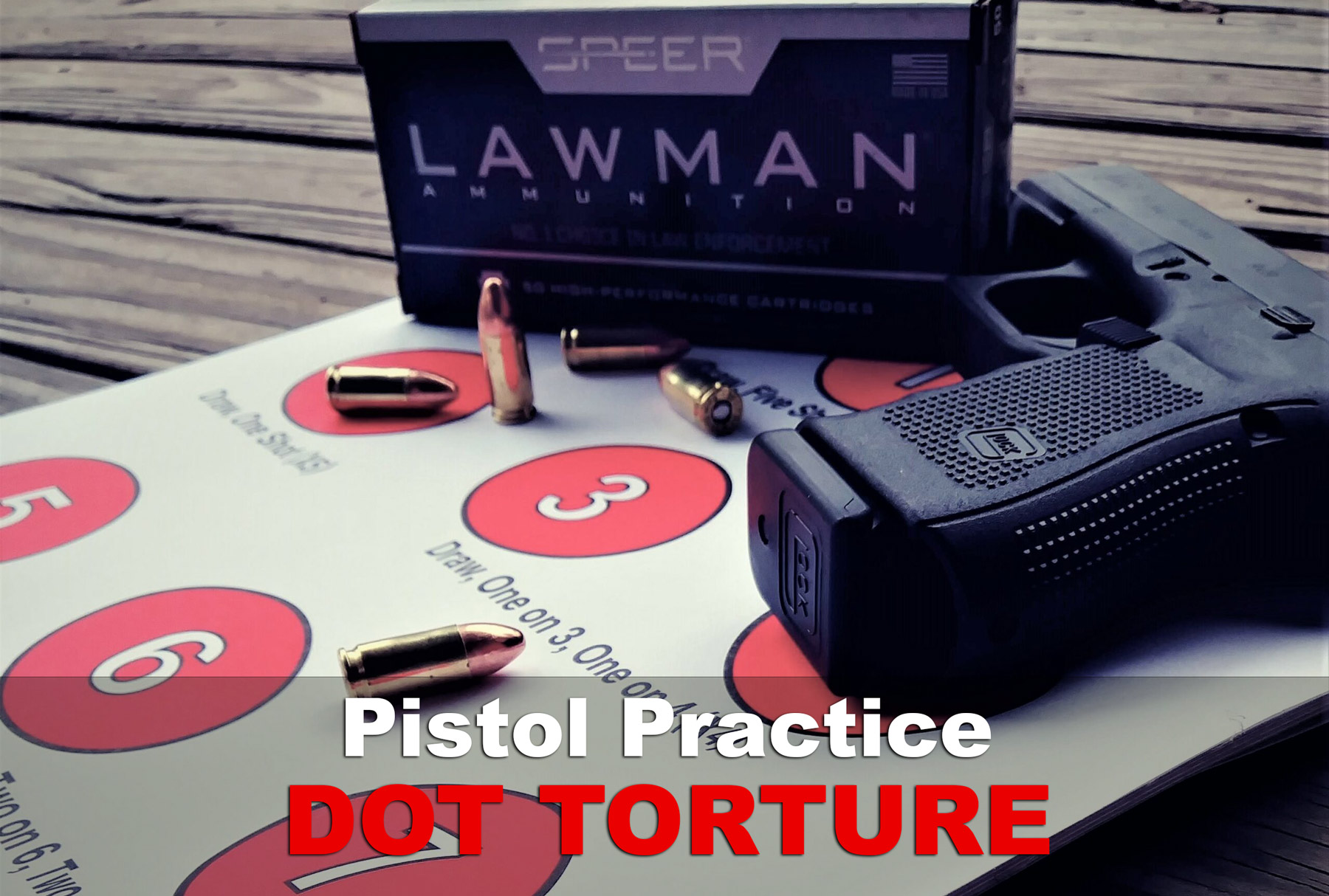 a dot torture target with ammo and a pistol at a shooting range