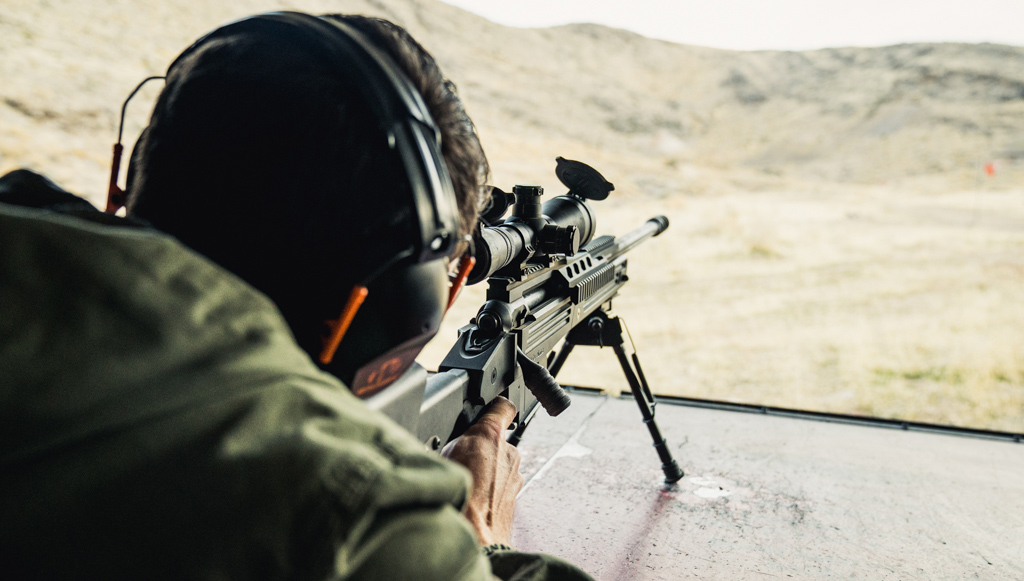 Firing 338 lapua rifle at a shooting range Firing a 338 Lapua rifle at a shooting range
