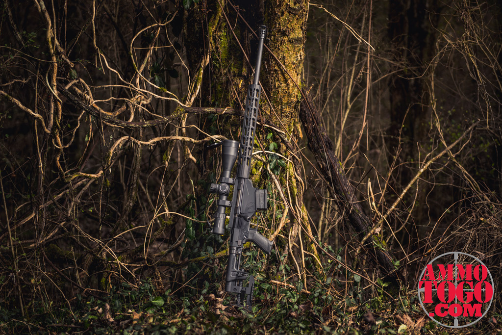 photo of a ruger precision rifle in 6.5 creedmoor outdoors against a tree