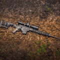 photo of the ruger precision rifle chambered in 6.5 creedmoor outside in the mud