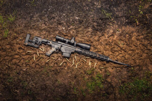 photo of the ruger precision rifle chambered in 6.5 creedmoor outside in the mud