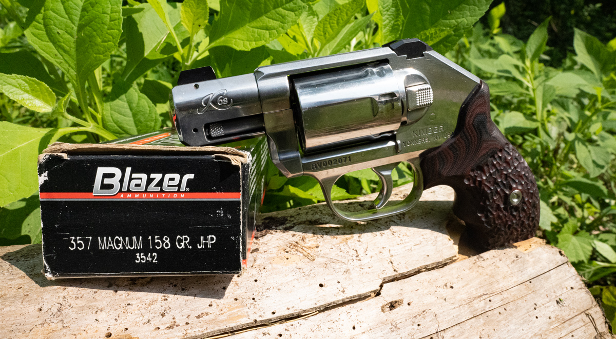 A Kimber snub nosed revolver with ammo at a shooting range