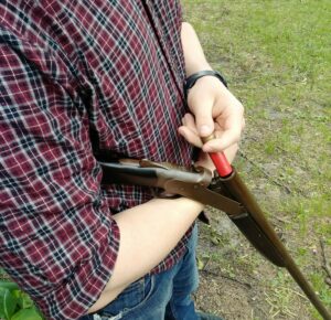 break action shotgun loading shells into a break action shotgun