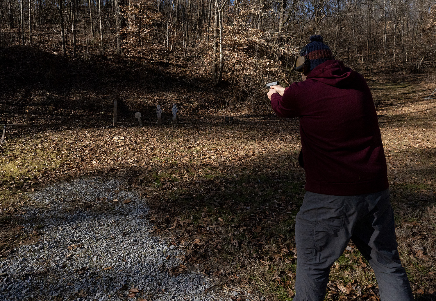Shooting 9mm pistols at an outdoor shooting range