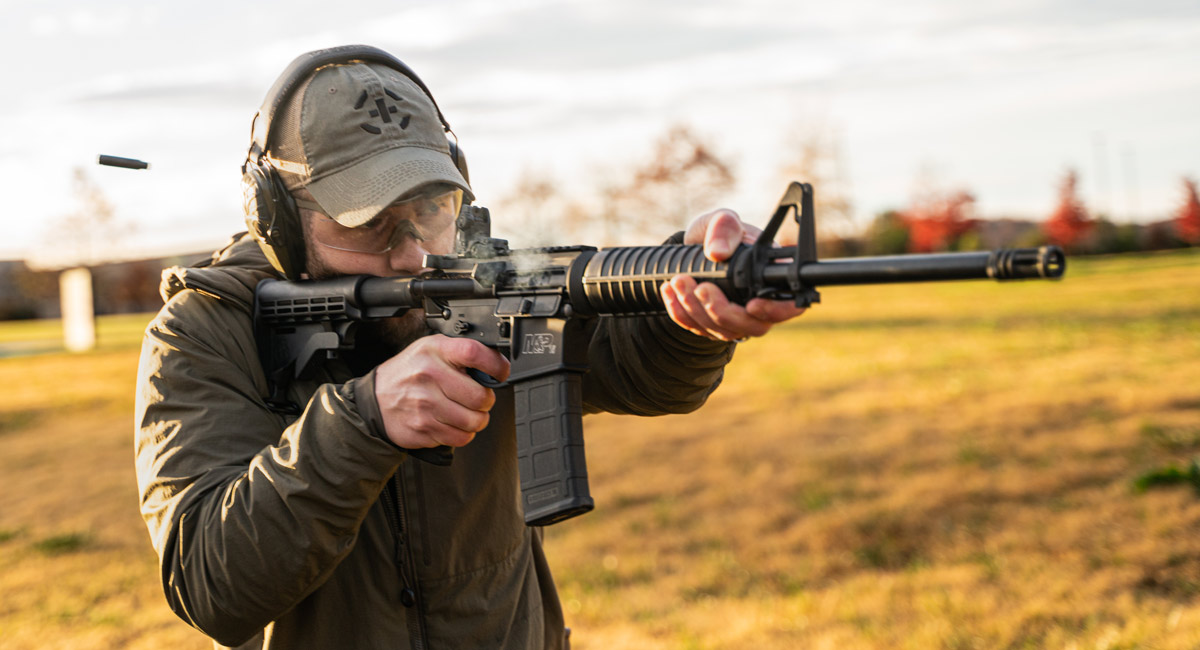 A rifleman firing an AR-15 equipped with a binary trigger