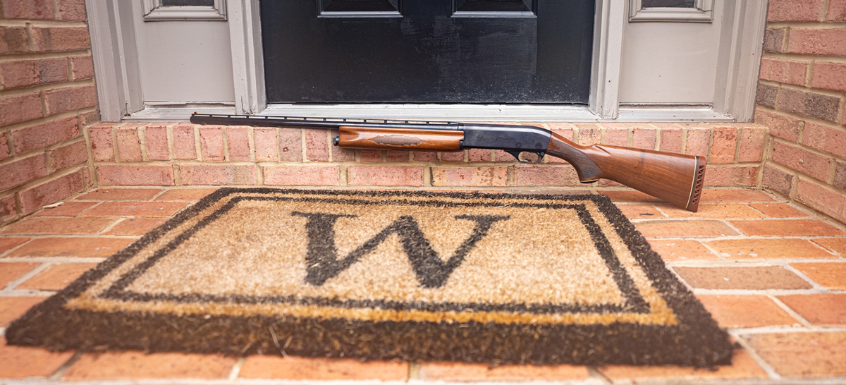 A shotgun at a front door of a home used for defense