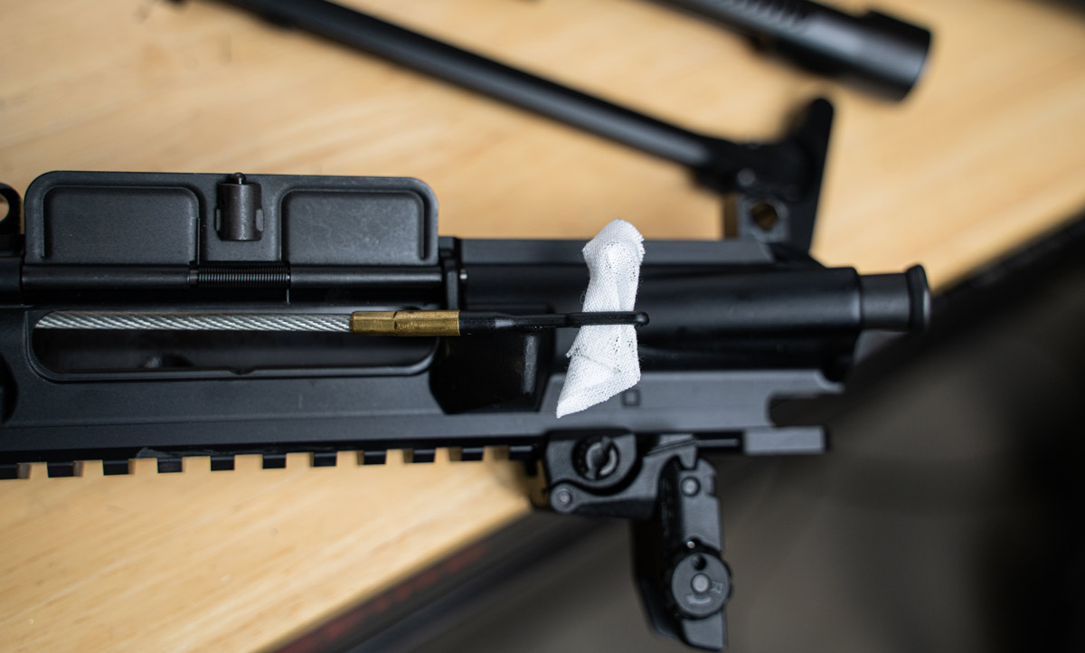 Using a gun cleaning patch to remove barrel fouling