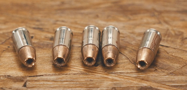 Winchester PDX1 9mm ammo laid out on a table