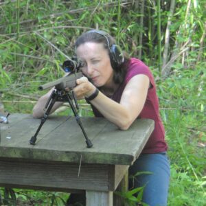 The author shooting a rifle at the range