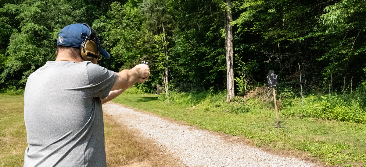 The author firing a snub nosed revolver at the range