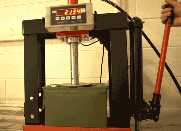 M2A2 ammo can buckles under the weight of a press