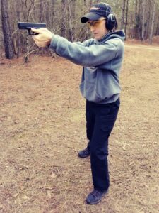 Alice demonstrating a good stance Alice, the author demonstrates a solid pistol stance with a 9mm pistol.