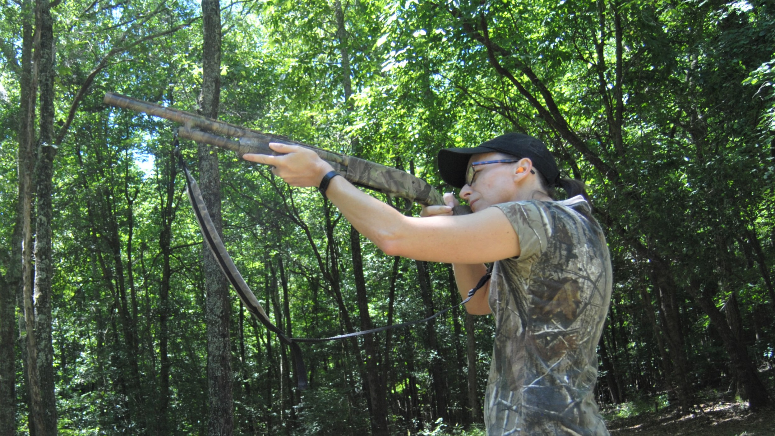 pointing and shooting a shotgun in the field