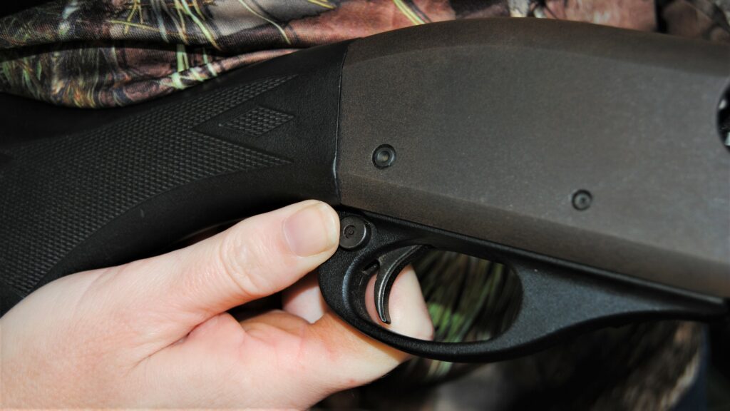 Safety on the side of a shotgun