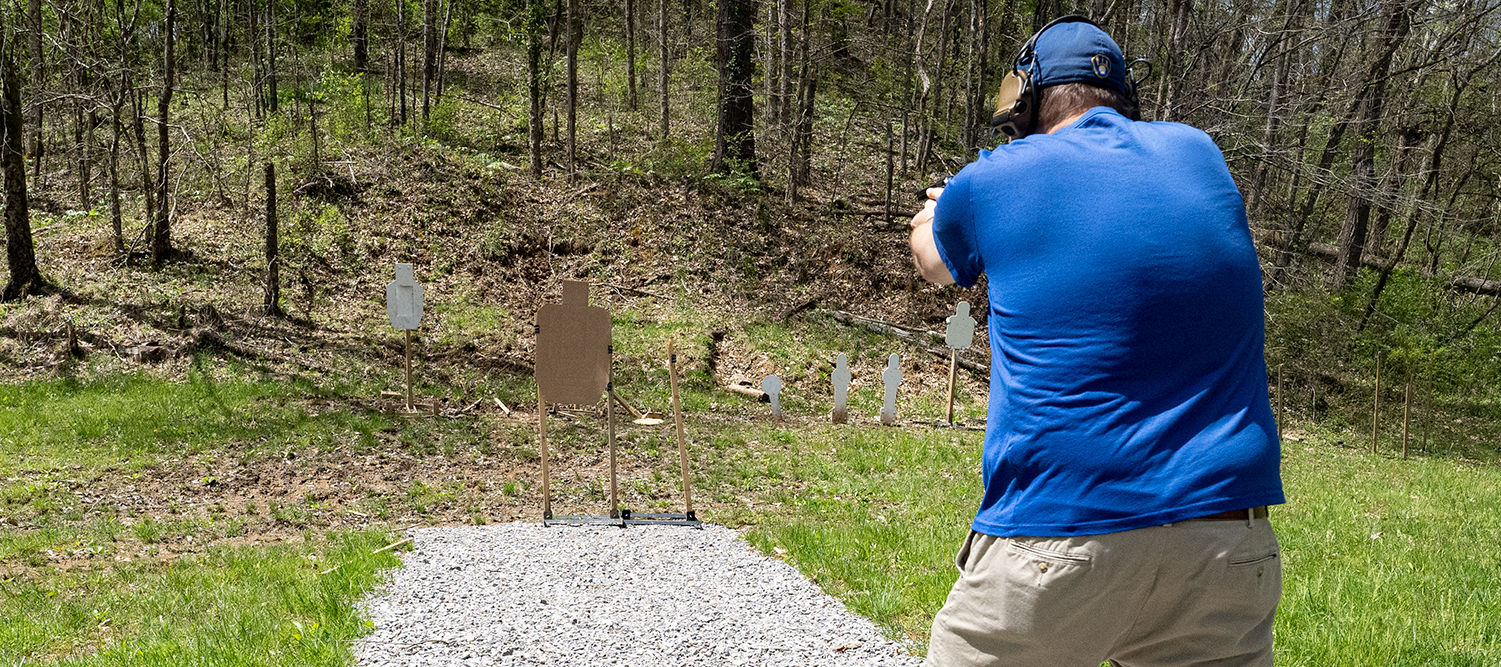 the author firing 32 ACP at the range